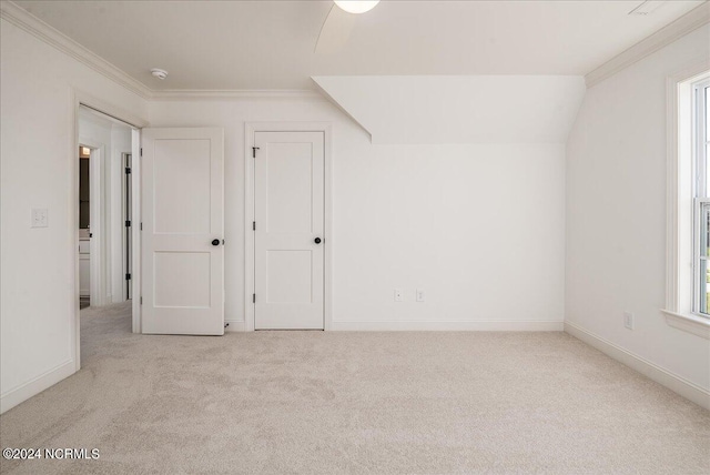 bonus room with lofted ceiling, ceiling fan, and light carpet