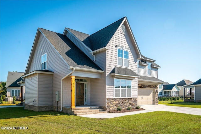 view of front of house with a front yard and a garage