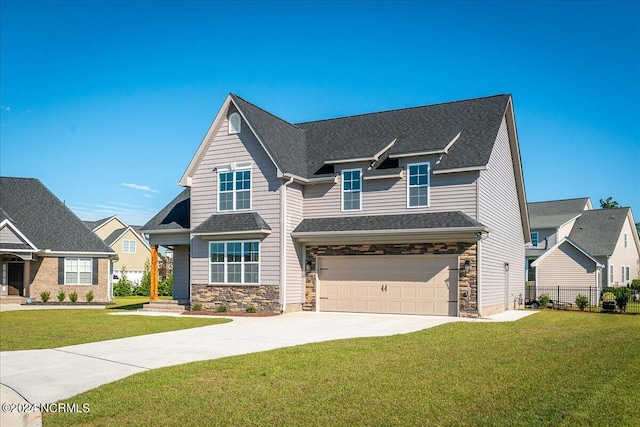 view of front facade featuring a garage and a front lawn