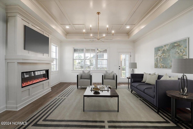 living room featuring ornamental molding, a chandelier, and hardwood / wood-style flooring