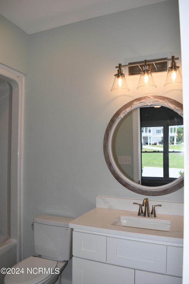 bathroom with vanity and toilet