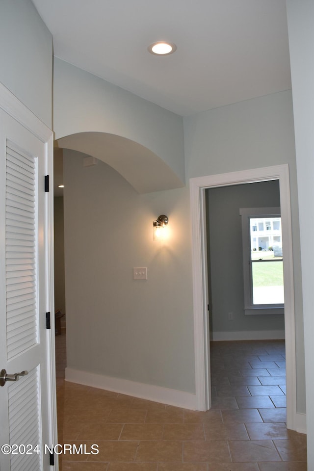 corridor featuring tile patterned flooring