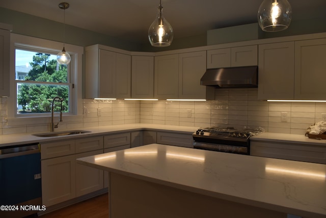 kitchen featuring sink, decorative backsplash, dishwasher, wall chimney exhaust hood, and black gas stove