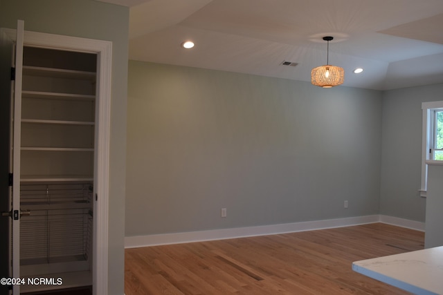 interior space featuring lofted ceiling and hardwood / wood-style floors