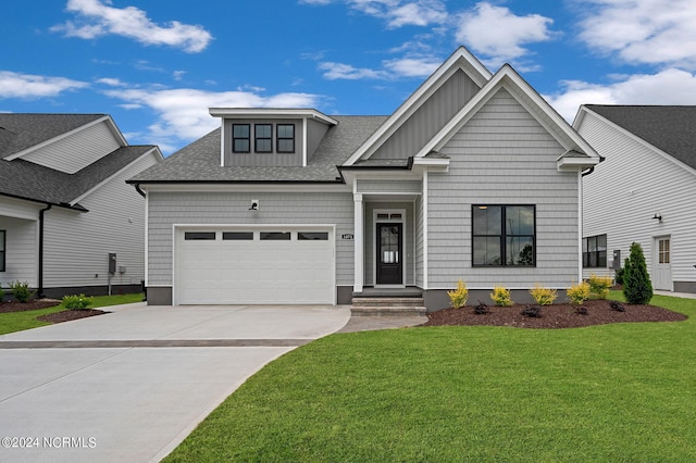 view of front facade with a front lawn and a garage