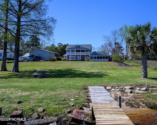 view of yard with a boat dock