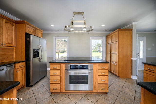 kitchen featuring appliances with stainless steel finishes, light tile floors, and a center island