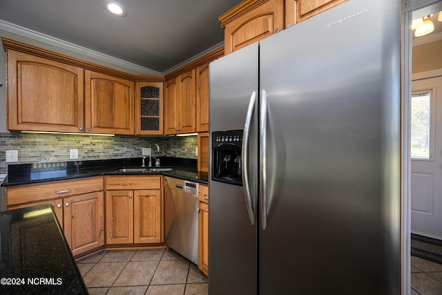 kitchen with sink, stainless steel appliances, tasteful backsplash, and light tile floors