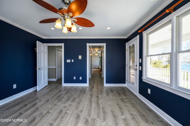 unfurnished bedroom featuring dark hardwood / wood-style flooring, ceiling fan, and multiple windows