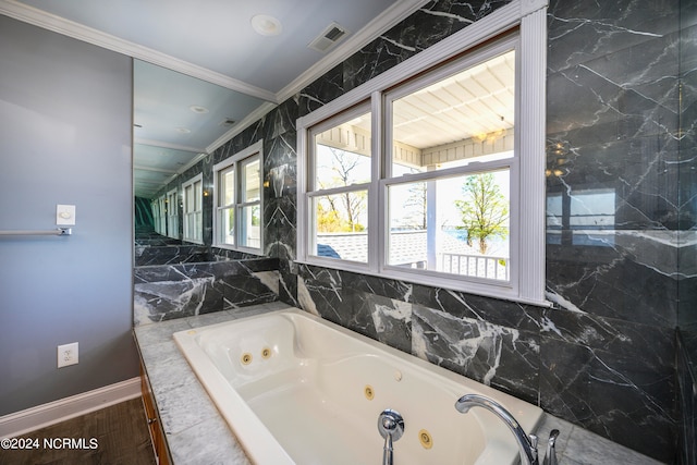 bathroom featuring ornamental molding, tile walls, and a wealth of natural light