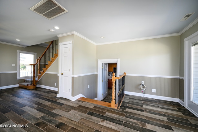 unfurnished room with crown molding and dark wood-type flooring