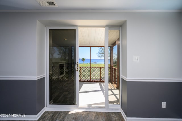 doorway to outside with a water view and dark hardwood / wood-style flooring