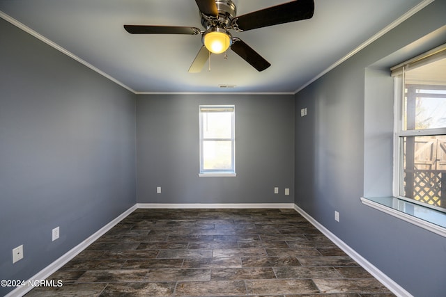 empty room with ceiling fan and ornamental molding