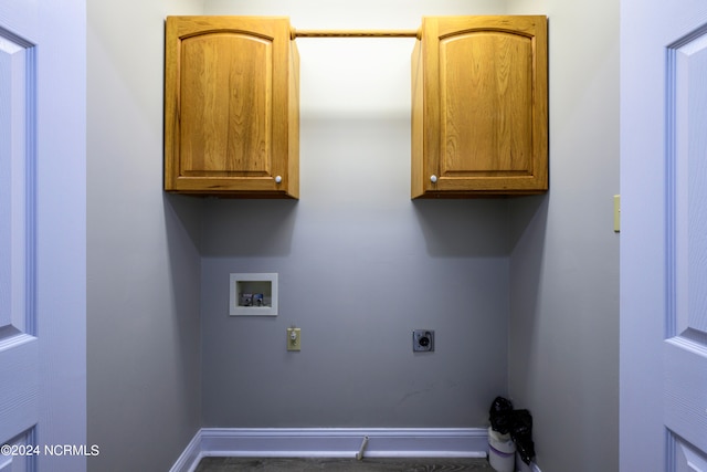 laundry room featuring hookup for a washing machine, hookup for an electric dryer, and cabinets