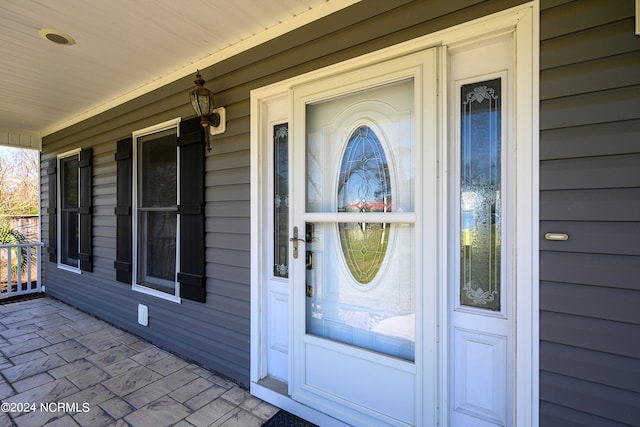 doorway to property with a porch