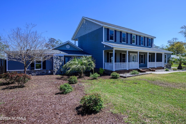 view of front of house with a porch and a front lawn