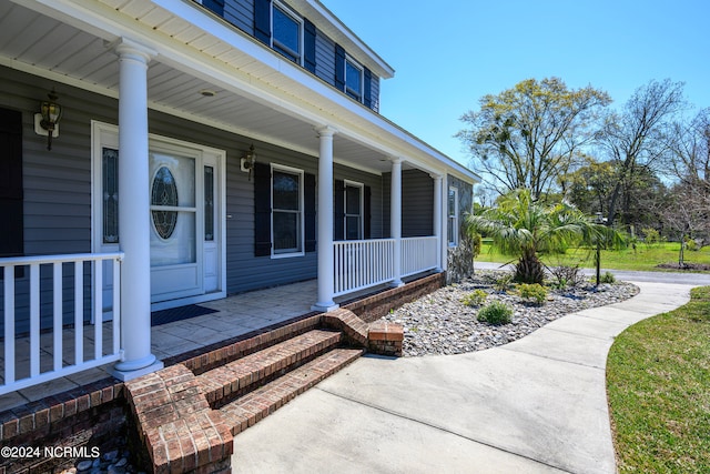 doorway to property with a porch