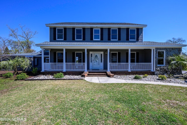 view of front of property featuring a porch and a front yard