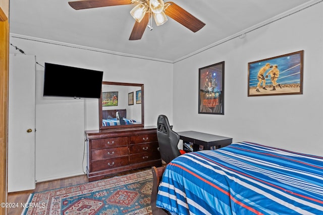 bedroom featuring ceiling fan and dark hardwood / wood-style floors