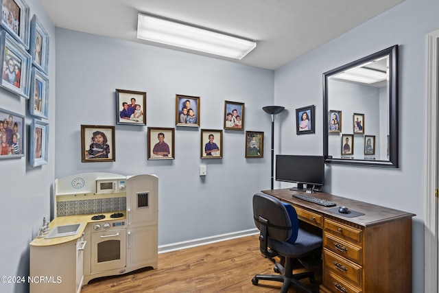 office space with hardwood / wood-style floors