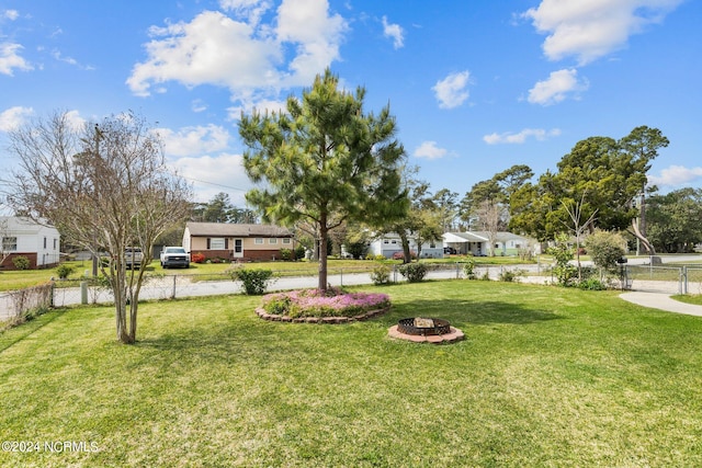 view of yard with an outdoor fire pit