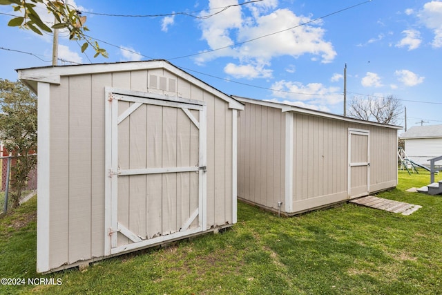 view of shed / structure with a yard