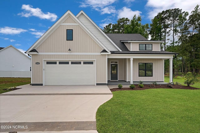 view of front facade featuring a front lawn, a porch, and a garage