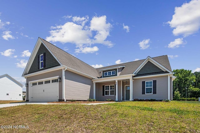 craftsman inspired home with a garage, covered porch, and a front lawn