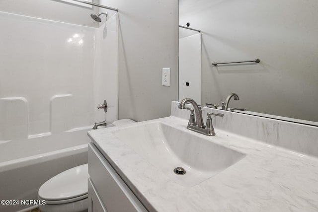 full bathroom with washtub / shower combination, vanity, and toilet