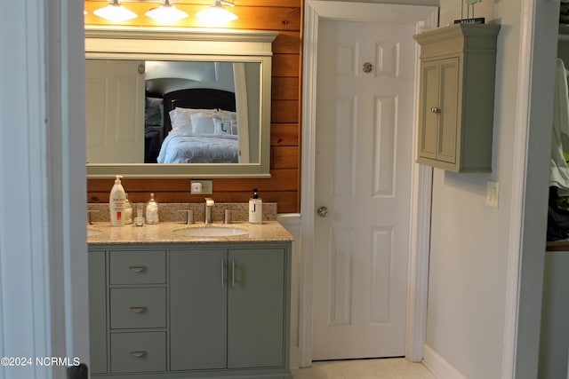 bathroom featuring vanity and tile flooring