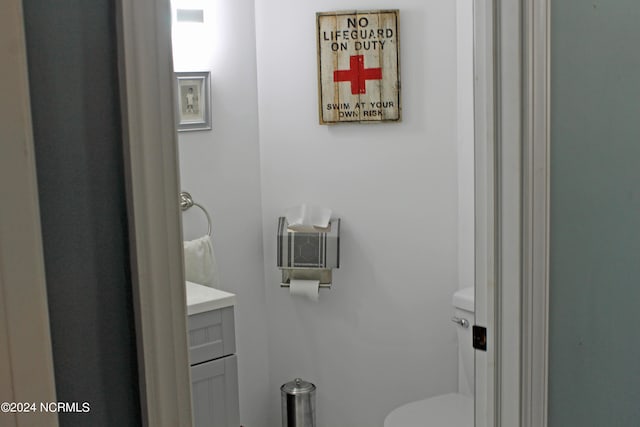 bathroom with toilet and vanity