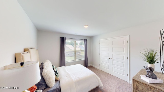 carpeted bedroom featuring a closet