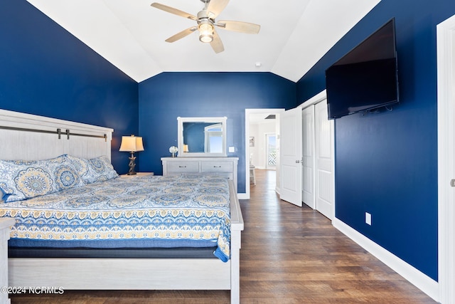 bedroom featuring lofted ceiling, ceiling fan, a closet, and dark hardwood / wood-style floors