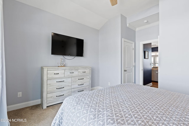 carpeted bedroom with ceiling fan and ornamental molding