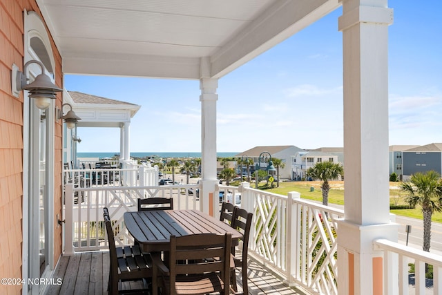 balcony featuring a water view