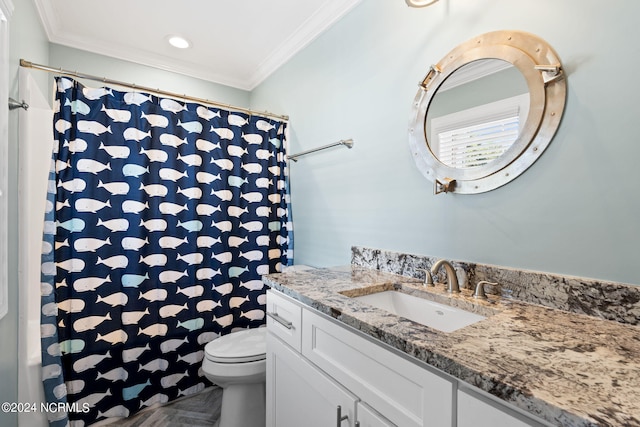 bathroom with ornamental molding, toilet, and large vanity