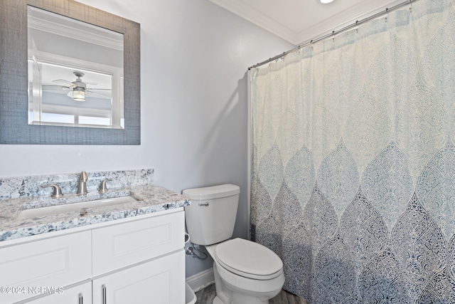 bathroom with ornamental molding, toilet, ceiling fan, and large vanity