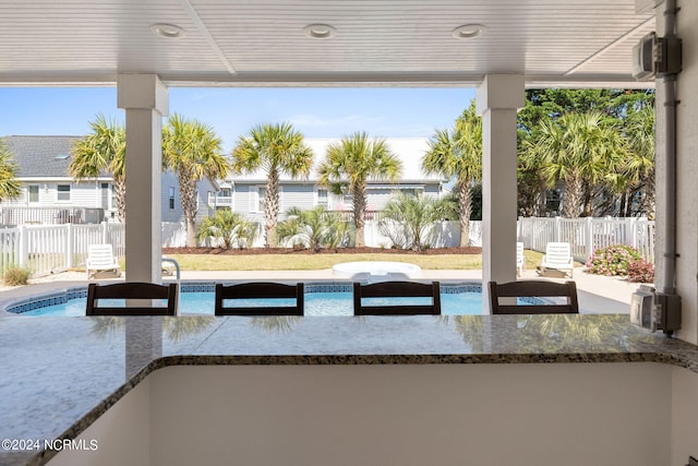 view of terrace featuring a pool with hot tub