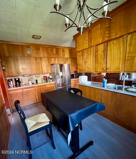 kitchen with stainless steel fridge and sink