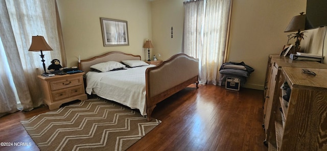 bedroom featuring dark wood-type flooring