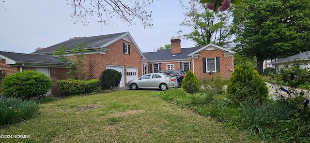 view of front of house featuring a garage and a front yard