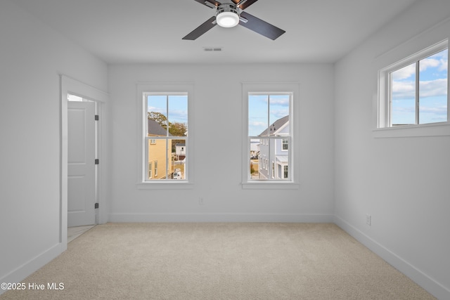 carpeted empty room with ceiling fan