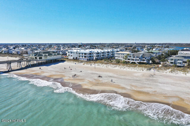 birds eye view of property featuring a view of the beach and a water view