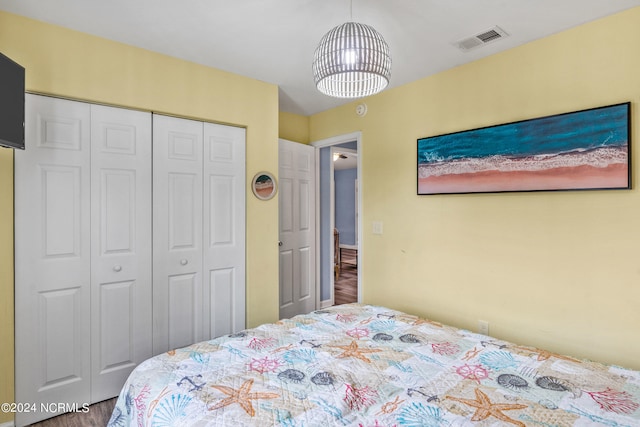 bedroom featuring a closet and hardwood / wood-style floors