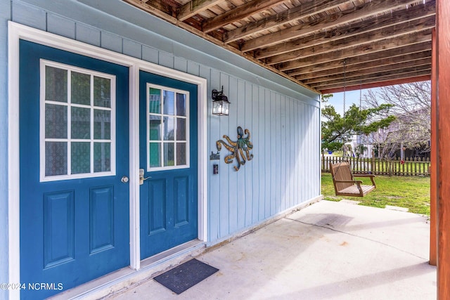 doorway to property featuring a patio