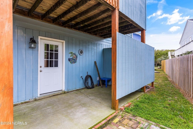 doorway to property with a patio area