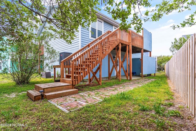 rear view of house with a wooden deck