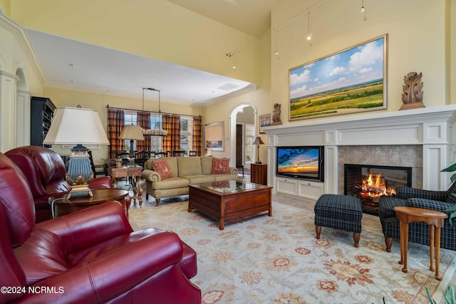 living room featuring a tile fireplace