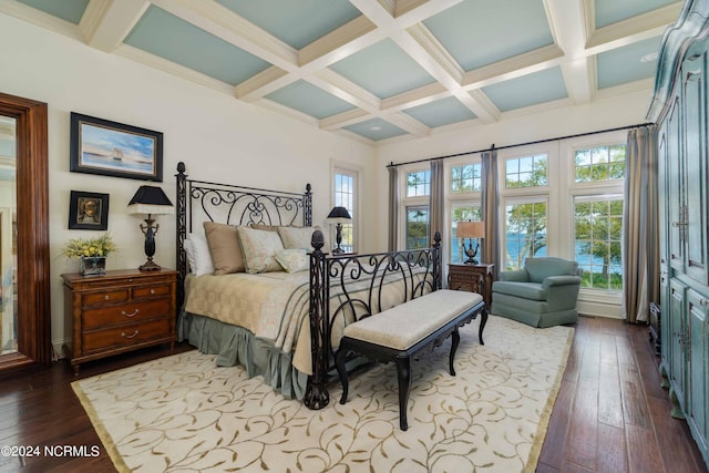 bedroom with hardwood / wood-style floors, beam ceiling, and coffered ceiling