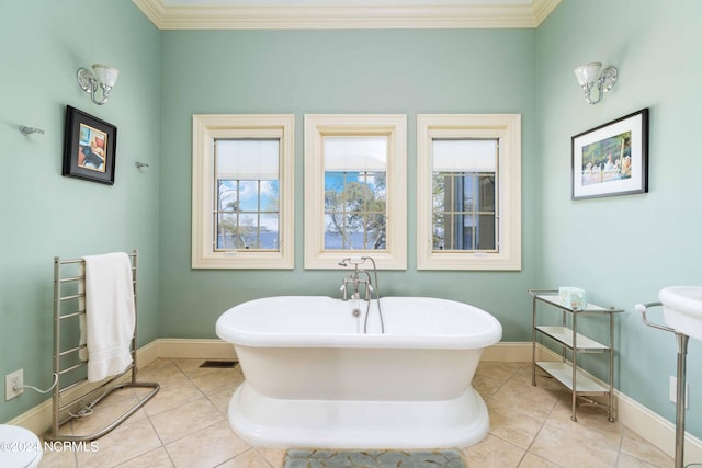 bathroom featuring crown molding, radiator heating unit, tile floors, and a bath to relax in